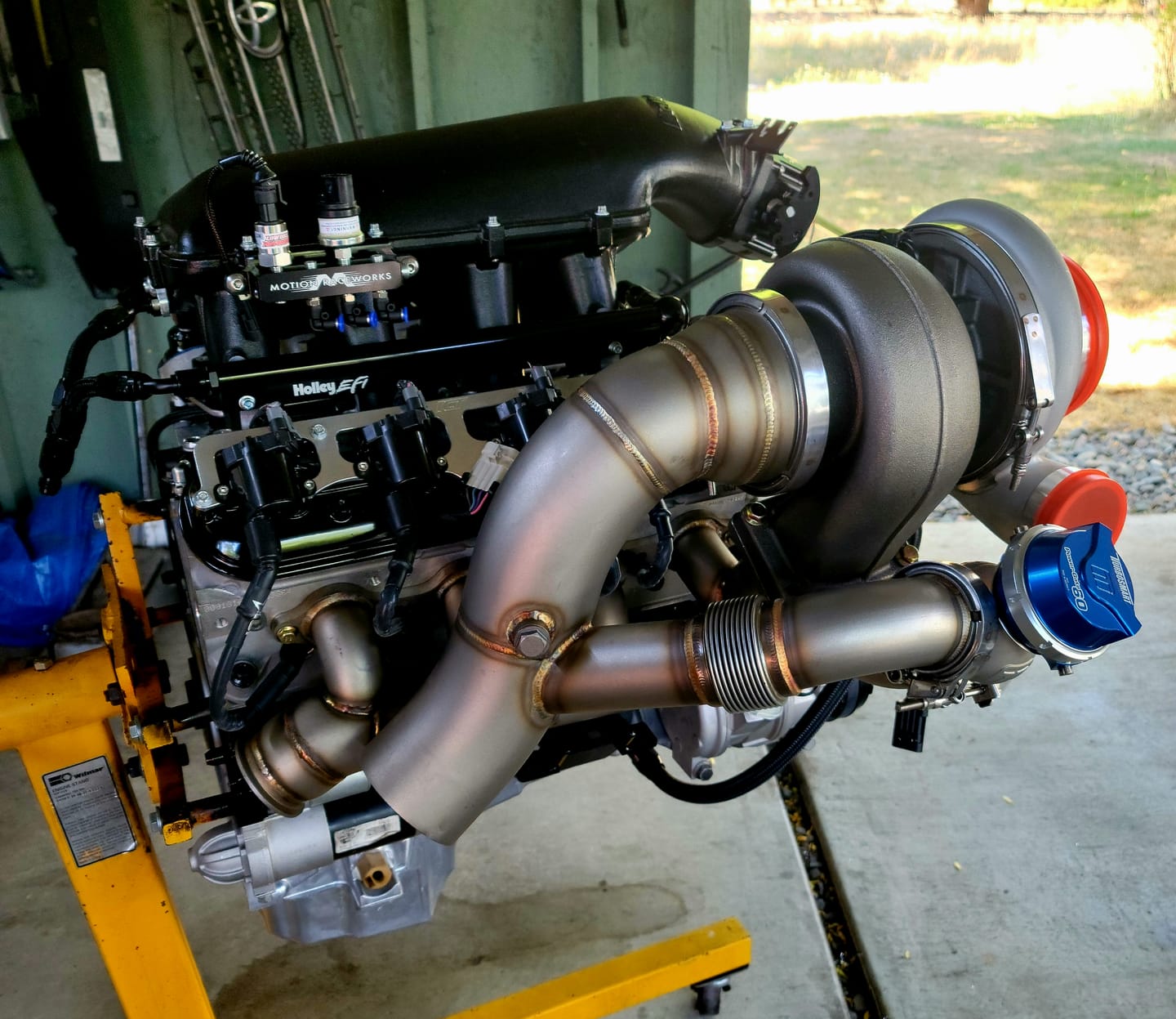 Customer photo review of Motion Raceworks Billet Valve Cover Breather / Oil Drain Billet (Single) 32-120-S