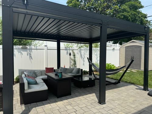 Customer photo review of EROMMY 12x16FT Louvered Pergola with 6-Panel Pull-Down Screen, Aluminum Pergola with Adjustable Rainproof Roof for Patio, Lawn & Garden, Dark Gray
