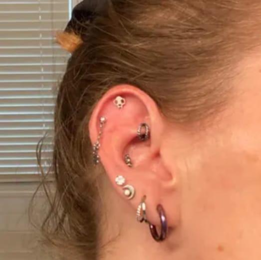 Customer photo review of Cat Skull Silhouette Nose Stud + Earring