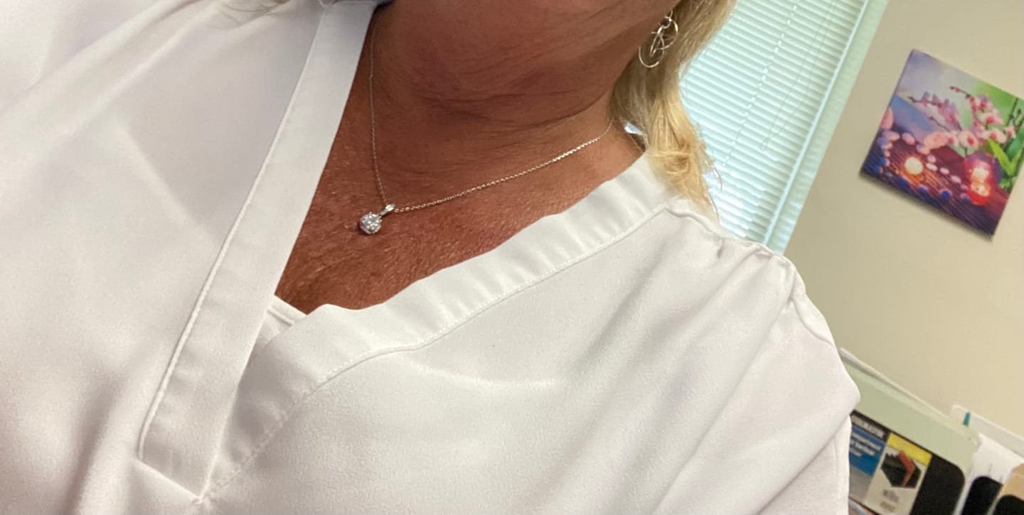 Customer photo review of Halo Round Moissanite Sterling Silver Necklace Pendant