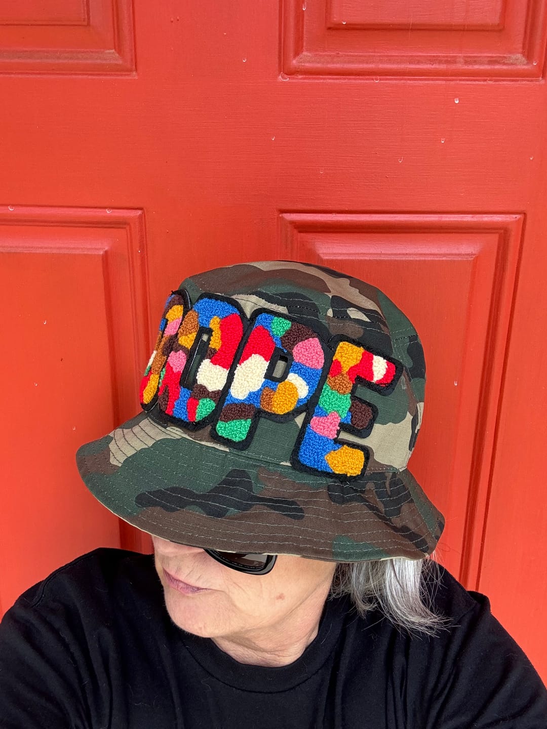 Customer photo review of Chenille Dope Camo Patched Unstructured Bucket Hat