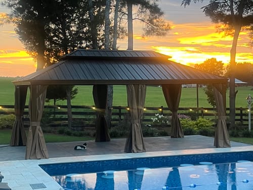 Customer photo review of EROMMY Luxury 12' x 20' Hardtop Gazebo, Wooden Finish Coated Aluminum Frame Gazebo with Galvanized Steel Double Roof, Brown Metal Gazebo with Curtains and Nettings