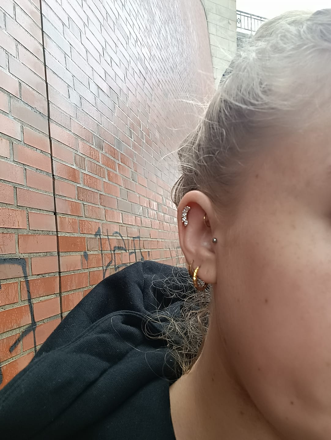 Customer photo review of Feather Piercing | Titan