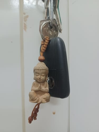 Customer photo review of Wooden Buddha Keychain - Free For Limited Time