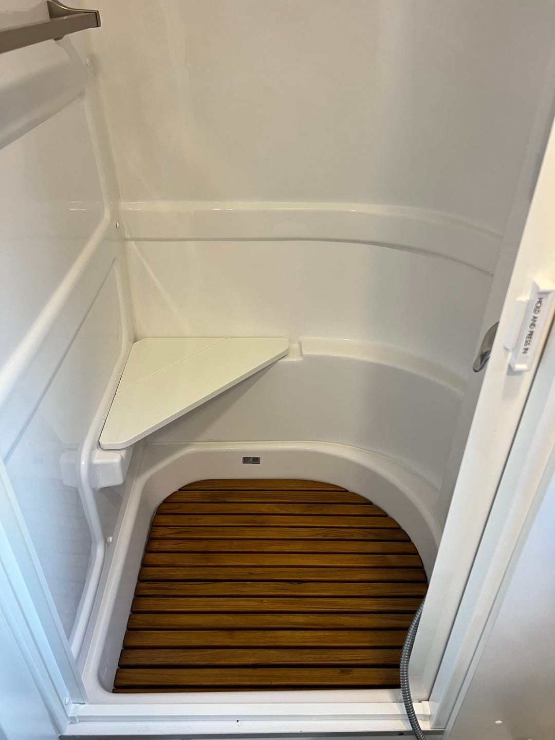Customer photo review of Corner Bath Airstream Teak Shower Mat (2021 and later)