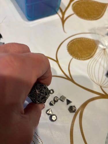 Customer photo review of Hollow Dragon D20 Mini-Dice Cage Necklace