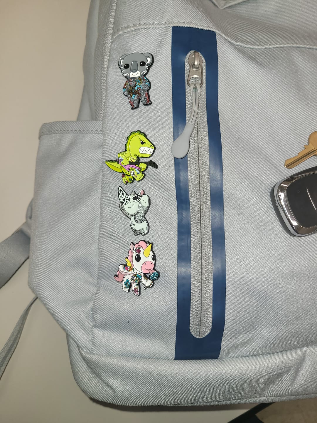 Customer photo review of Sandy the Sloth Enamel Pin