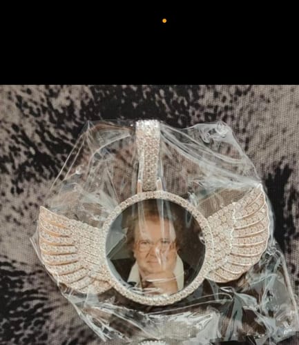 Customer photo review of VVS Moissanite Angel Wings Memory Pendant