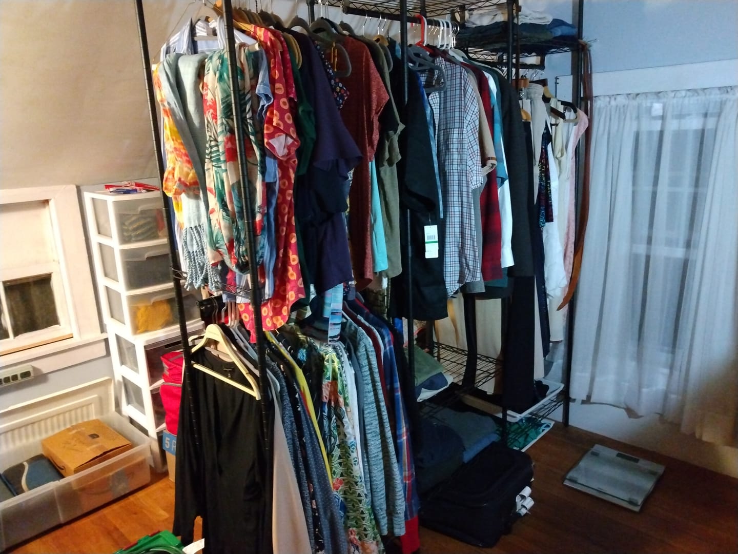 Customer photo review of Raybee 830lbs Portable Clothes Rack Heavy Duty, Freestanding Wire Clothing Rack with 4 Hanging Rods & Shelves, Adjustable Closet Wardrobe Organizer for Bedroom,Black/White