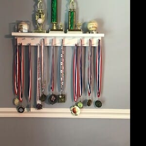 Customer photo review of 2ft Medal Awards Rack Premier Trophy Shelf- Trophy, Plaque and Medal Display