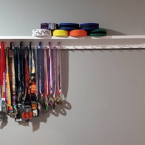 Customer photo review of 4ft Medal Awards Rack Premier Trophy Shelf- Trophy, Plaque and Medal Display