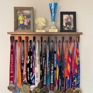 Customer photo review of 2ft Medal Awards Rack Premier Trophy Shelf- Trophy, Plaque and Medal Display