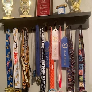 Customer photo review of 2ft Medal Awards Rack Premier Trophy Shelf- Trophy, Plaque and Medal Display