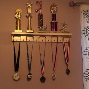 Customer photo review of 2ft Medal Awards Rack Premier Trophy Shelf- Trophy, Plaque and Medal Display