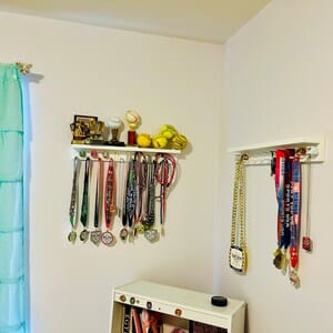 Customer photo review of 2ft Medal Awards Rack Premier Trophy Shelf- Trophy, Plaque and Medal Display