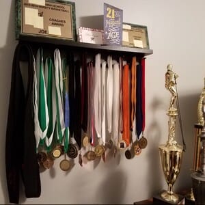 Customer photo review of 2ft Medal Awards Rack Premier Trophy Shelf- Trophy, Plaque and Medal Display