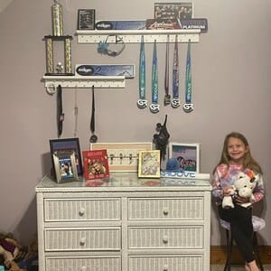 Customer photo review of 2ft Medal Awards Rack Premier Trophy Shelf- Trophy, Plaque and Medal Display