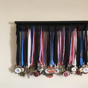 Customer photo review of 2ft Medal Awards Rack Premier Trophy Shelf- Trophy, Plaque and Medal Display
