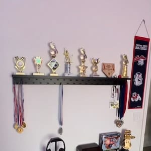 Customer photo review of 4ft Medal Awards Rack Premier Trophy Shelf- Trophy, Plaque and Medal Display
