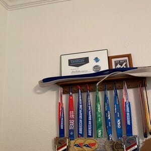 Customer photo review of 2ft Medal Awards Rack Premier Trophy Shelf- Trophy, Plaque and Medal Display
