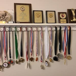 Customer photo review of 4ft Medal Awards Rack Premier Trophy Shelf- Trophy, Plaque and Medal Display