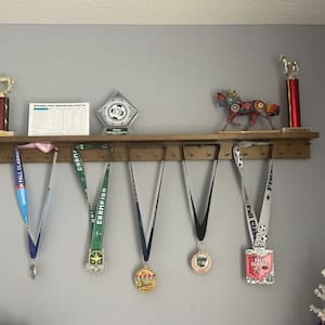 Customer photo review of 4ft Medal Awards Rack Premier Trophy Shelf- Trophy, Plaque and Medal Display