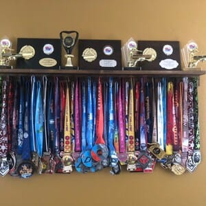 Customer photo review of 4ft Medal Awards Rack Premier Trophy Shelf- Trophy, Plaque and Medal Display