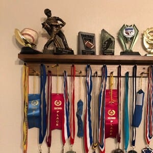 Customer photo review of 2ft Medal Awards Rack Premier Trophy Shelf- Trophy, Plaque and Medal Display