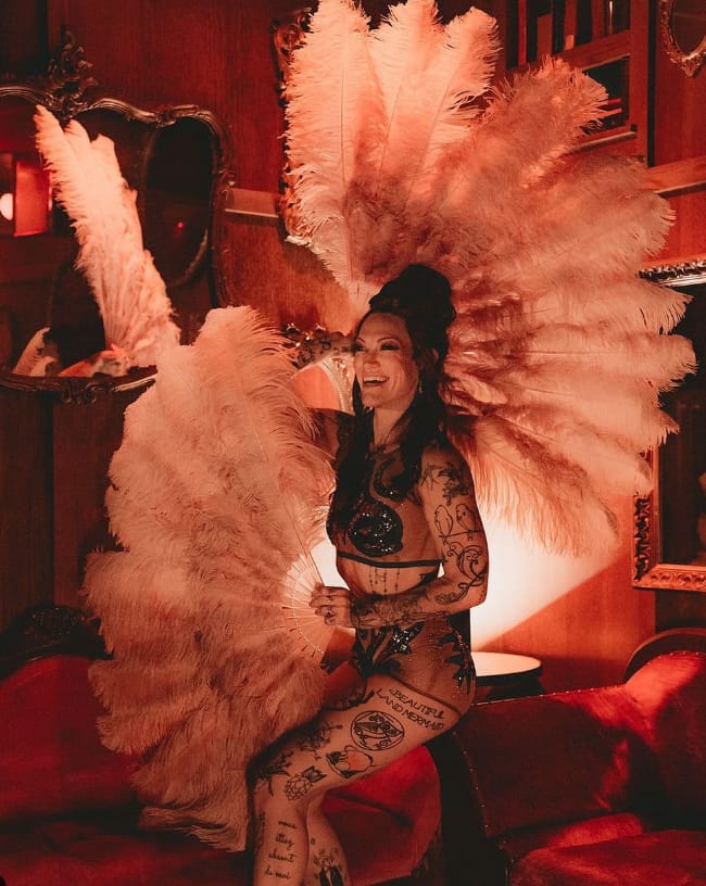 Customer photo review of beige wood XL 2 layers Ostrich Feather Fan 34"x 60"
