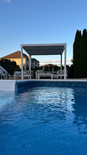 Customer photo review of EROMMY 10' x 10' Outdoor Louvered Pergola, Patio Hardtop Gazebo for Garden Yard, Curtains and Netting Included, White