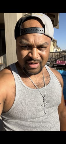 Customer photo review of Moissanite Wrapped Cross Pendant 14K Gold