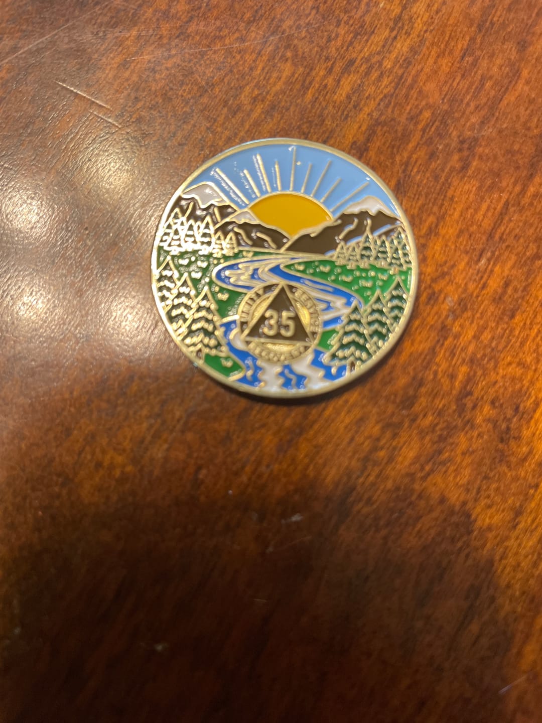 Customer photo review of 1 to 65 Year Sobriety Mint Winding River Gold Plated AA Recovery Medallion/Chip/Coin