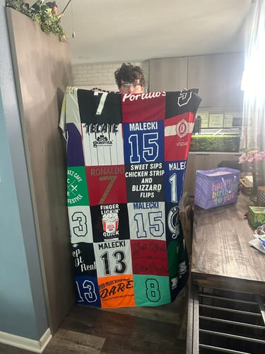 T-shirt quilt with sports, food themes by Megan from IN