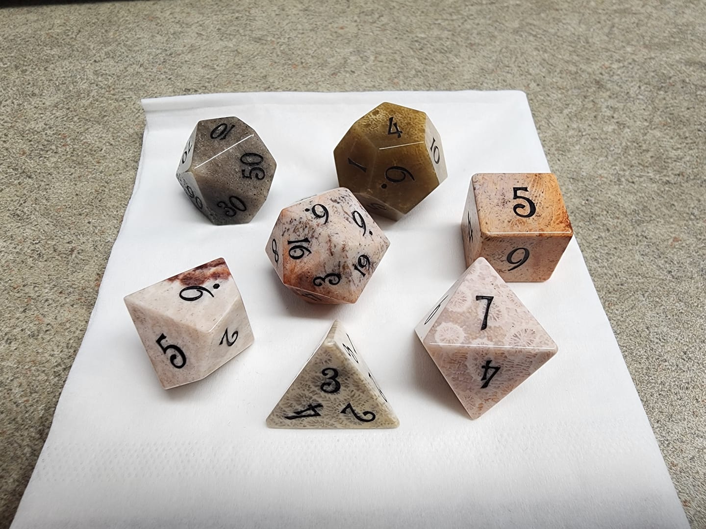Customer photo review of URWizards D&D Coral Fossil Gemstone Engraved Dice Set