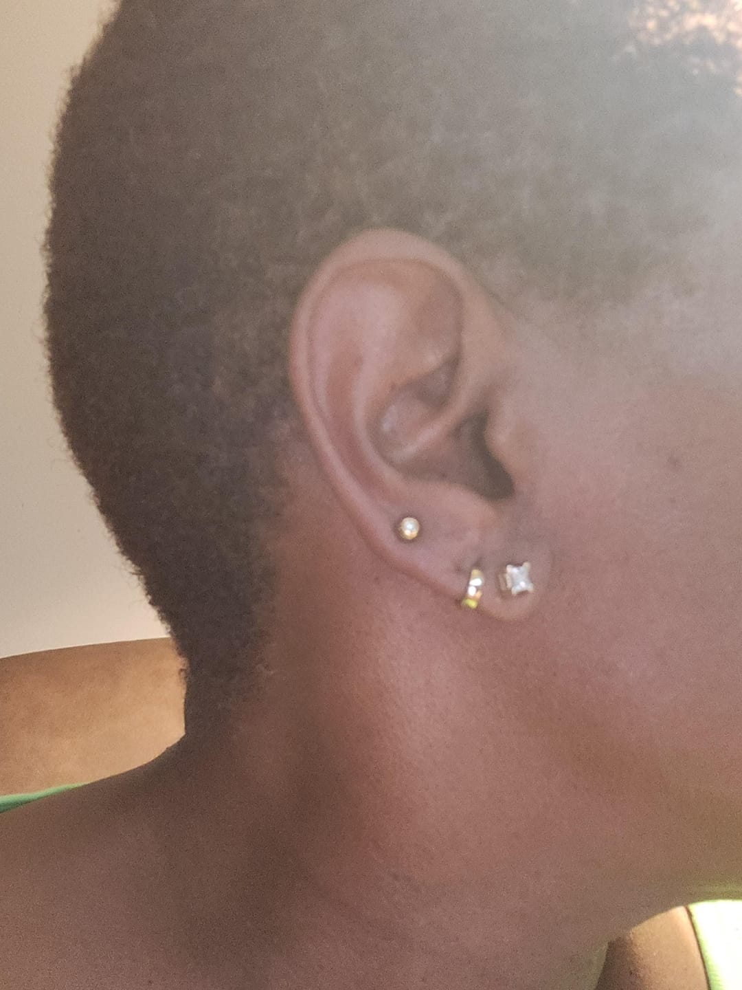 Customer photo review of Wide Dome Huggie Hoop Earrings, Solid 14K Gold