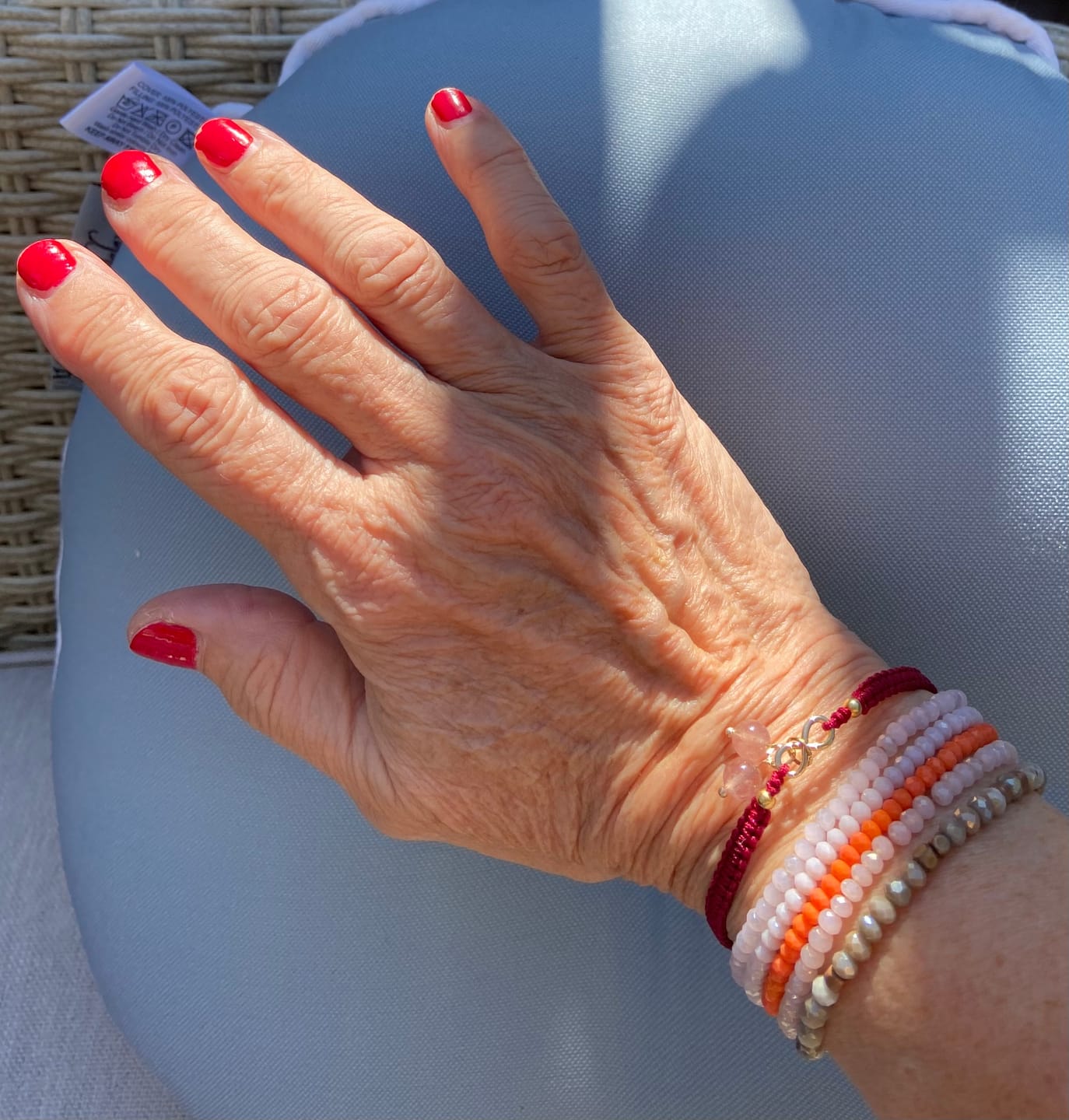 Customer photo review of Buddha Stones Strawberry Quartz Crystal Endless Knot Love Healing Red String Weave Bracelet