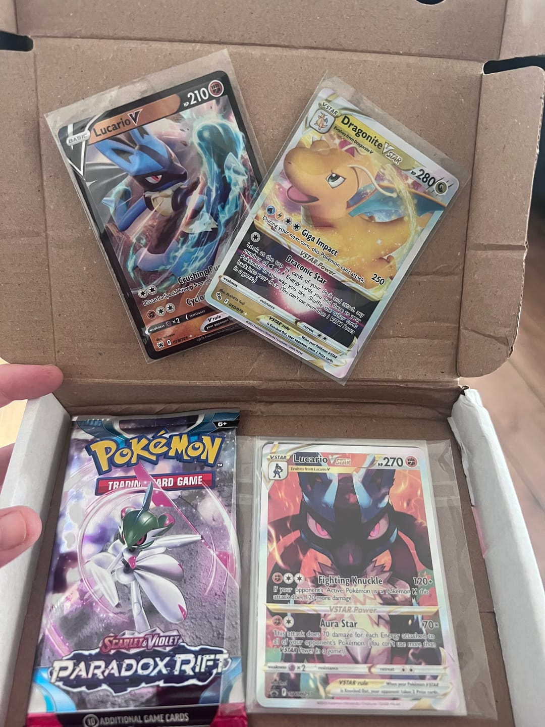 Customer photo review of Pokemon TCG - 5 random V cards and 3 mystery cards