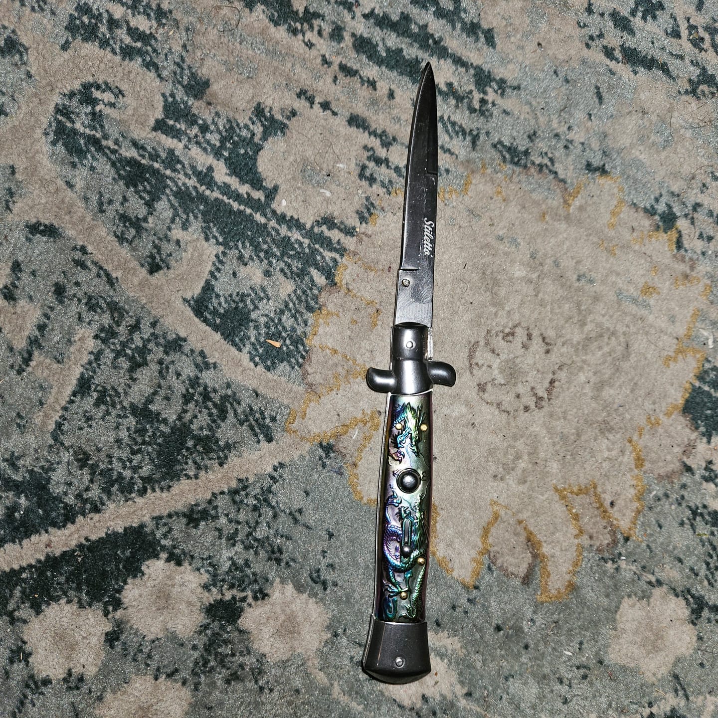 Customer photo review of 9.5" Italian Style Stiletto Switch Blade Pocket Knife Dragon
