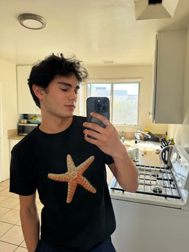 Customer photo review of 'Starfish' baby tee