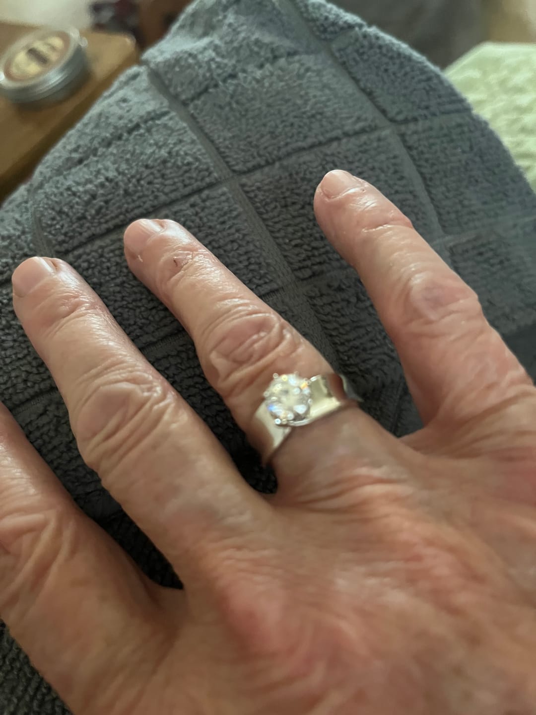 Customer photo review of Solitaire Round Moissanite Concave Wide Band Engagement Ring