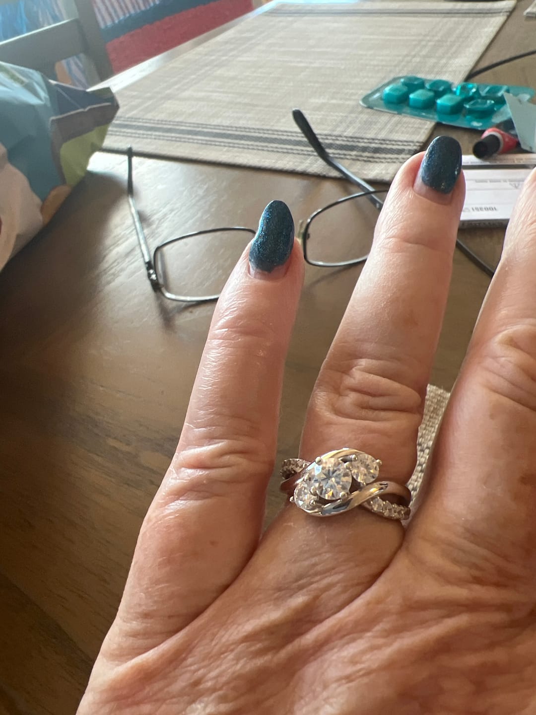 Customer photo review of Swirl Three Stone Moissanite Twisted Pave Engagement Ring