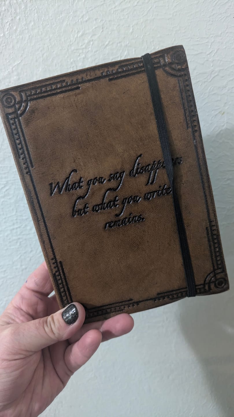Customer photo review of What You Write Remains Quote Leather Journal - 7x5