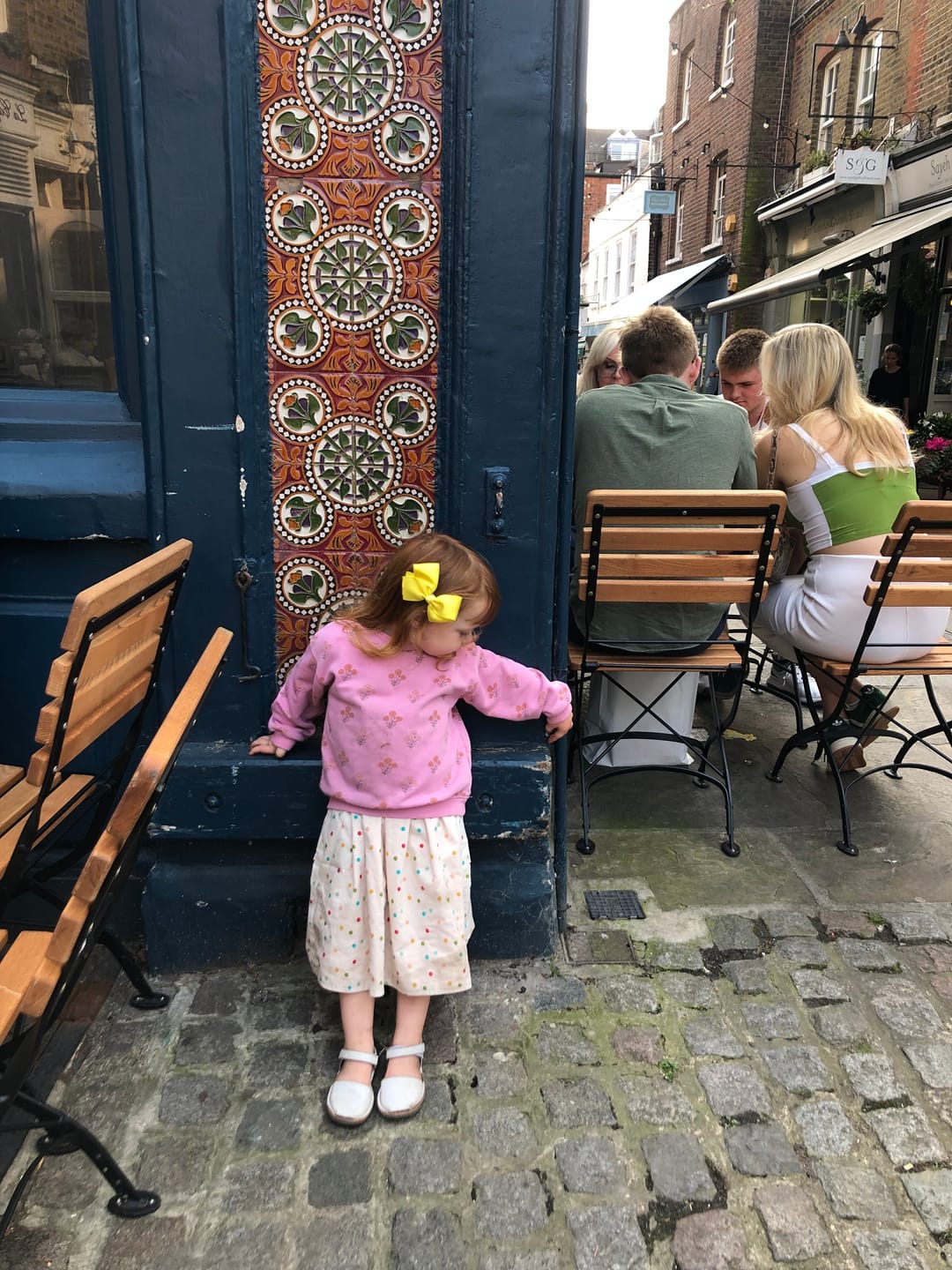Customer photo review of Rainbow Spots Reversible Pinny Dress
