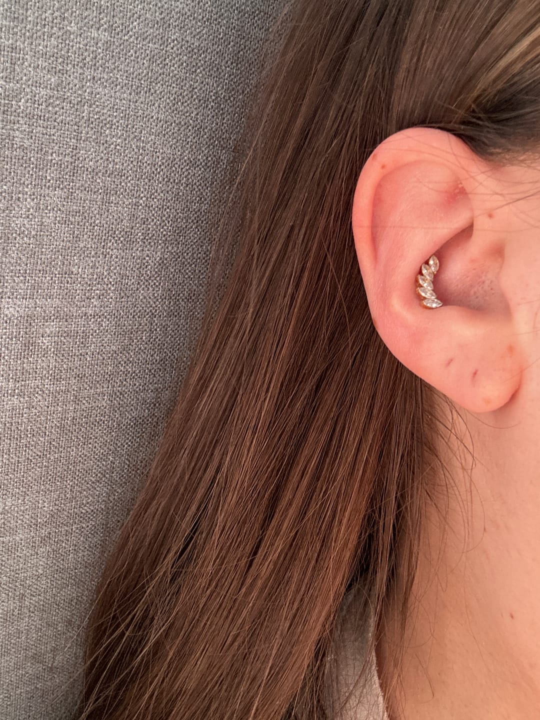 Customer photo review of Feather Piercing | Titan