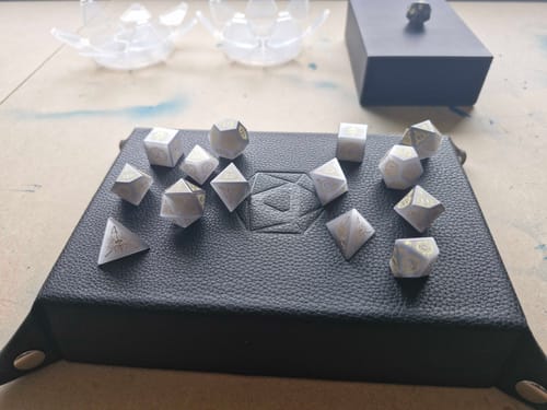 Customer photo review of URWizards D&D Grey Cat's Eye Engraved Dice Set Warlock Style