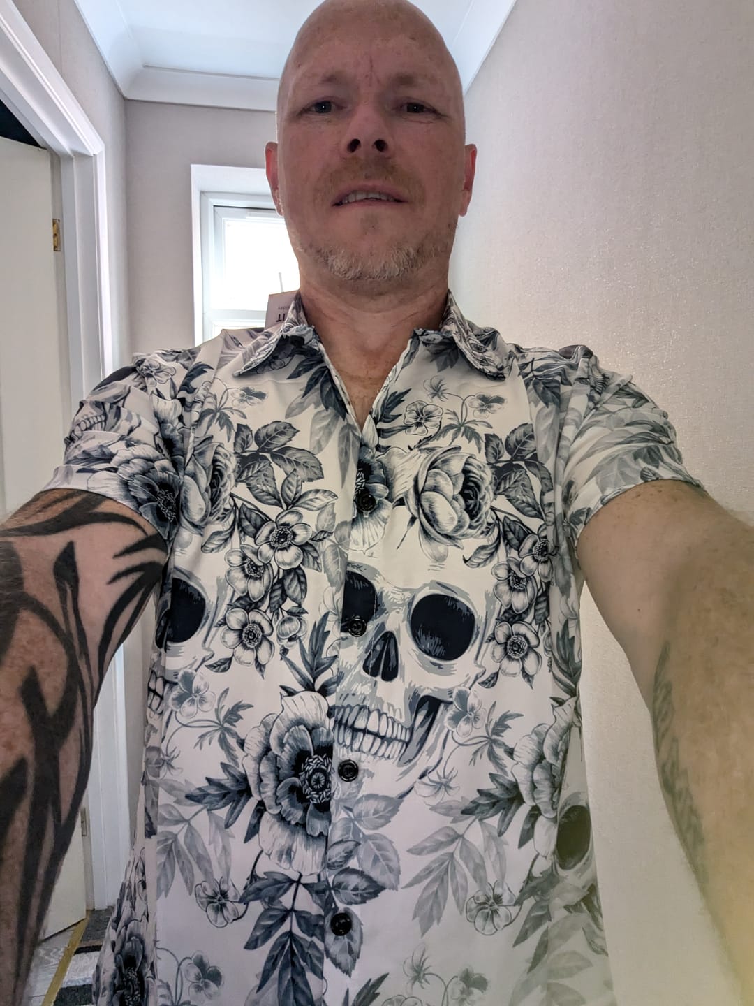 Customer photo review of Men's Skull Floral Print Casual Lapel Button Short Sleeve Shirt