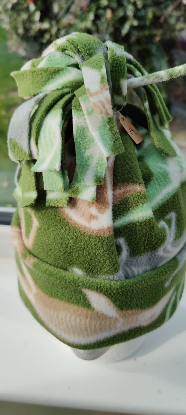 Customer photo review of Dino Skeletons on Green Anti Pill Polar Fleece Fabric