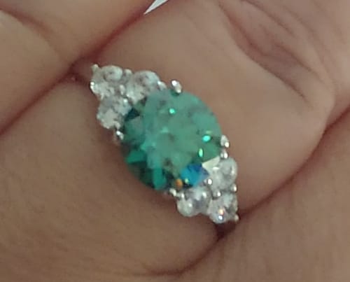 Customer photo review of Green Moissanite Side Stone Engagement Ring