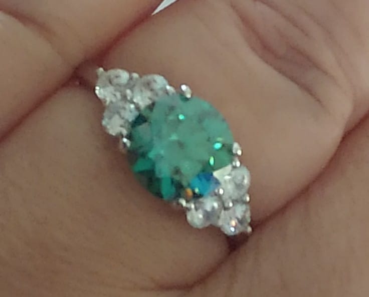 Customer photo review of Green Moissanite Side Stone Engagement Ring