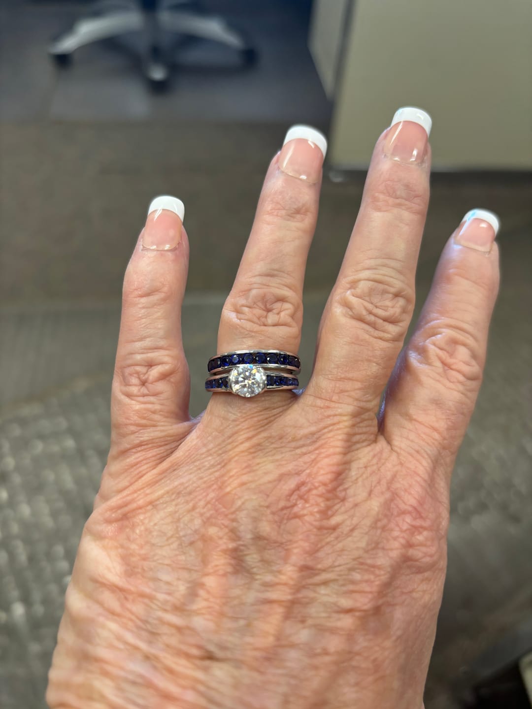 Customer photo review of Half Bezel Moissanite With Sapphire Channel Set Engagement Ring
